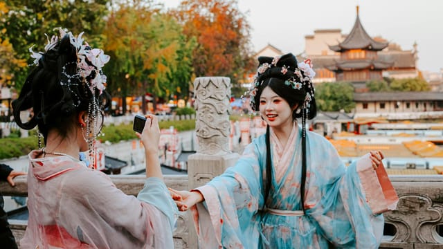 Two women in traditional Hanfu attire in Nanjing, China, capturing vibrant cultural heritage.