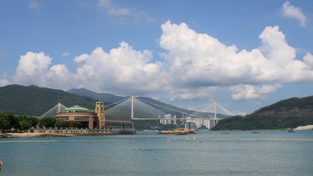 Beautiful view of Tsing Ma Bridge over Ma Wan Channel in Hong Kong, clear skies.