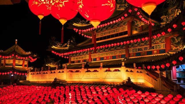 Stunning display of red lanterns at a traditional Chinese festival during nighttime.