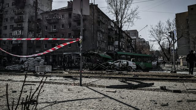 A devastated street in Kyiv showcasing war damage and destruction.